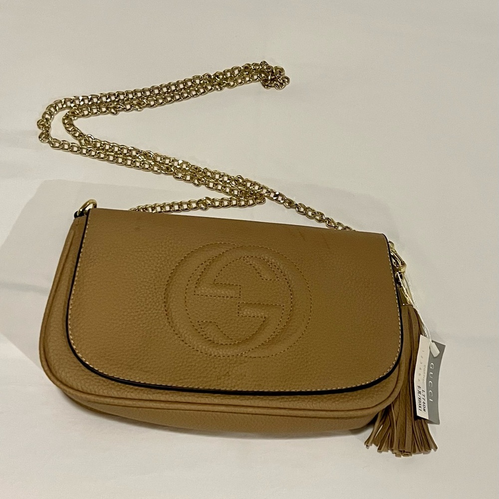 Tan bag with gold strap